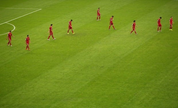 a-dejected-spain-walks-off-the-pitch-after-losing-to-chile