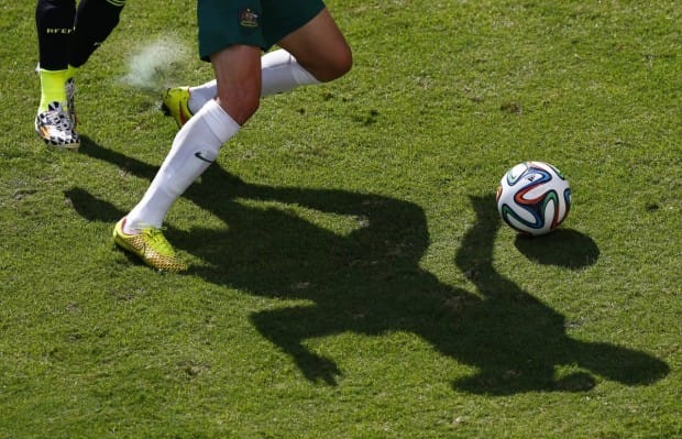 australias-ryan-mcgowan-and-spains-jordi-albas-shadows-fight-for-the-ball