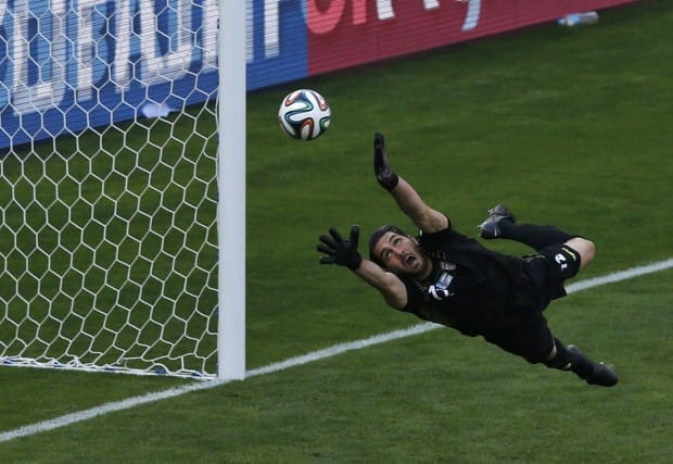 irans-goalie-alireza-haghighi-tries-and-fail-to-save-a-messi-goal