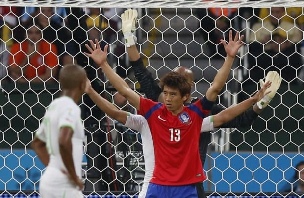 south-koreas-koo-ja-cheol-celebrates-his-goal-as-alergias-defenders-raise-their-arms-in-disbelief
