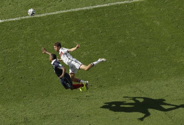 thomas-mueller-of-germany-and-patrice-evra-of-france-fight-to-win-a-header-during-their-quarterfinal-match